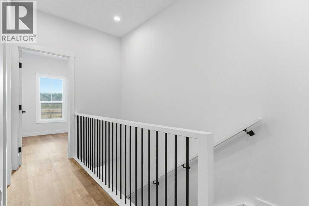 102, 156 Park Street, Cochrane, AB - Indoor Photo Showing Other Room