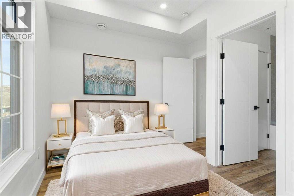 102, 156 Park Street, Cochrane, AB - Indoor Photo Showing Bedroom