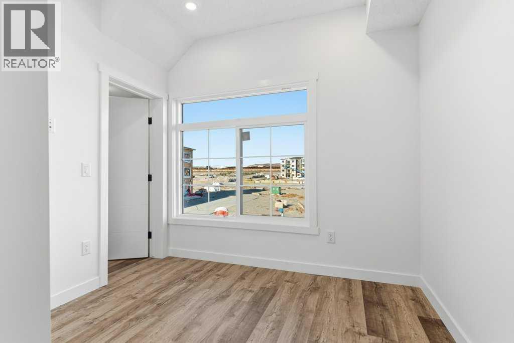 102, 156 Park Street, Cochrane, AB - Indoor Photo Showing Other Room