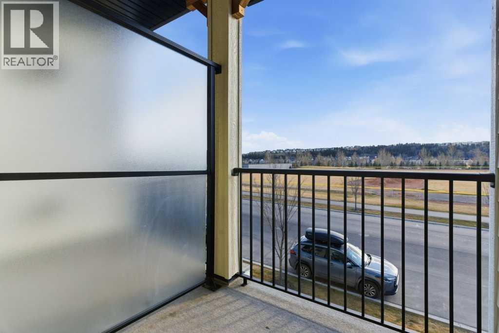 102, 156 Park Street, Cochrane, AB - Outdoor With Balcony With View