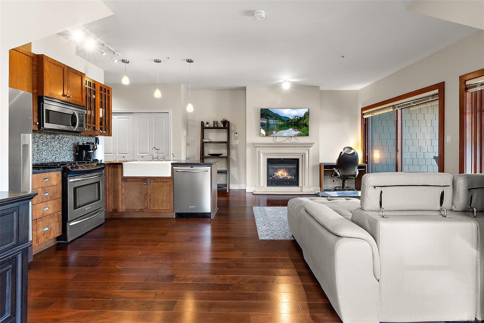 407-2006 Troon Crt, Langford, BC - Indoor Photo Showing Kitchen With Fireplace