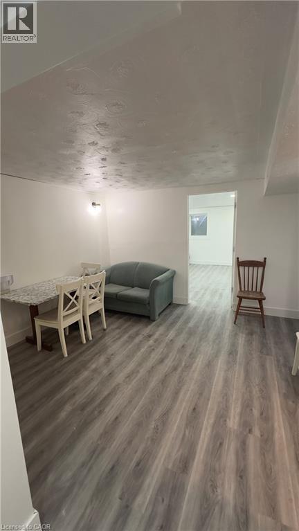 Bonus room featuring wood finished floors and baseboards - 18 Ingleside Drive, Kitchener, ON - Indoor