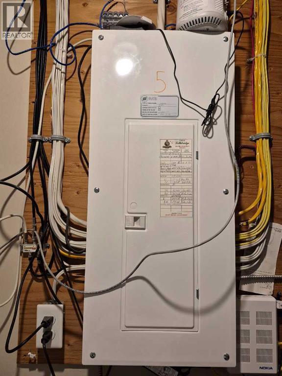100-amp electrical panel - 5, 438 Highlands Boulevard W, Lethbridge, AB - Indoor Photo Showing Basement