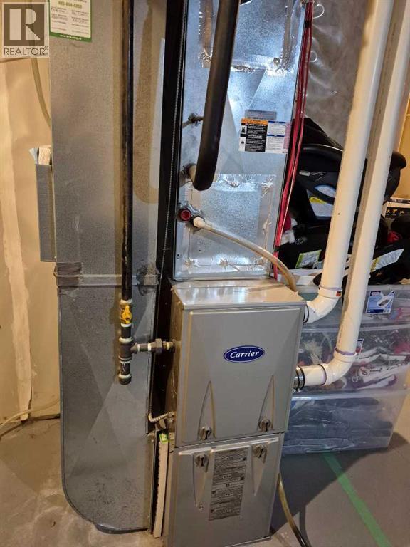 Forced air furnace - 5, 438 Highlands Boulevard W, Lethbridge, AB - Indoor Photo Showing Basement