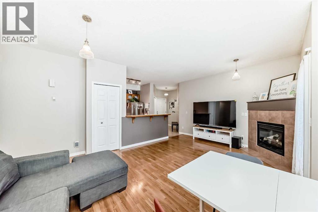 106, 628 56 Avenue Sw, Calgary, AB - Indoor Photo Showing Living Room With Fireplace