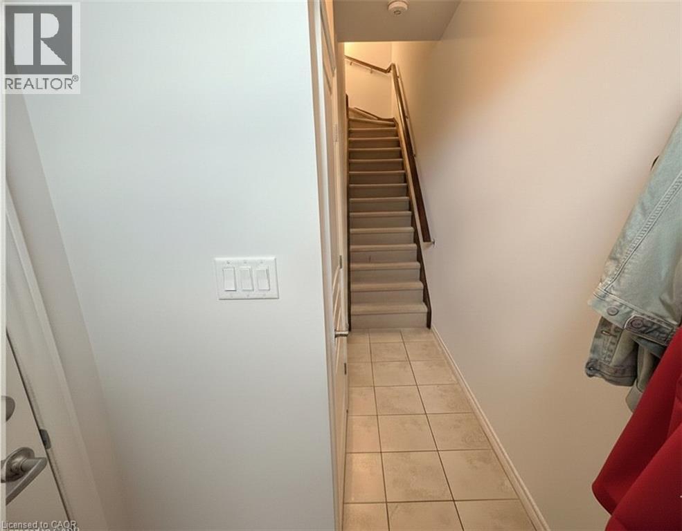 main floor entry with man door to garage, closet and stairs to 2nd main level (old photo) - 352 Louisa Street, Kitchener, ON - Indoor Photo Showing Other Room