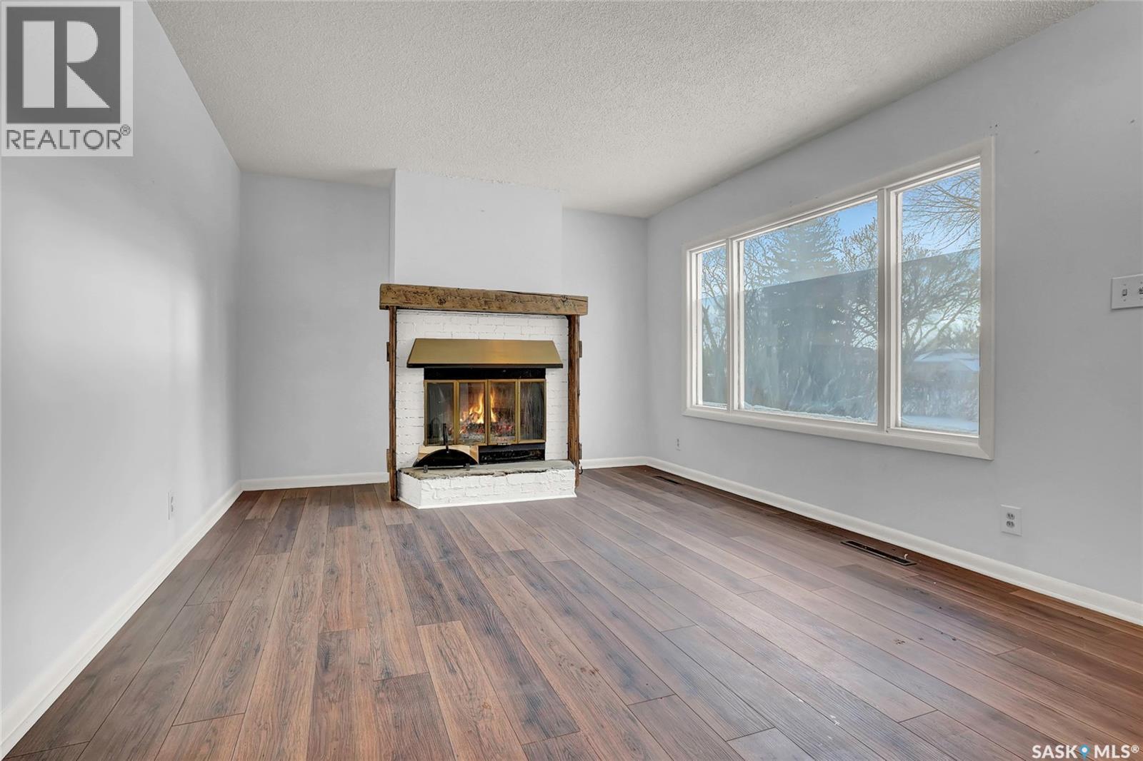 5336 5Th Avenue, Regina, SK - Indoor Photo Showing Living Room With Fireplace