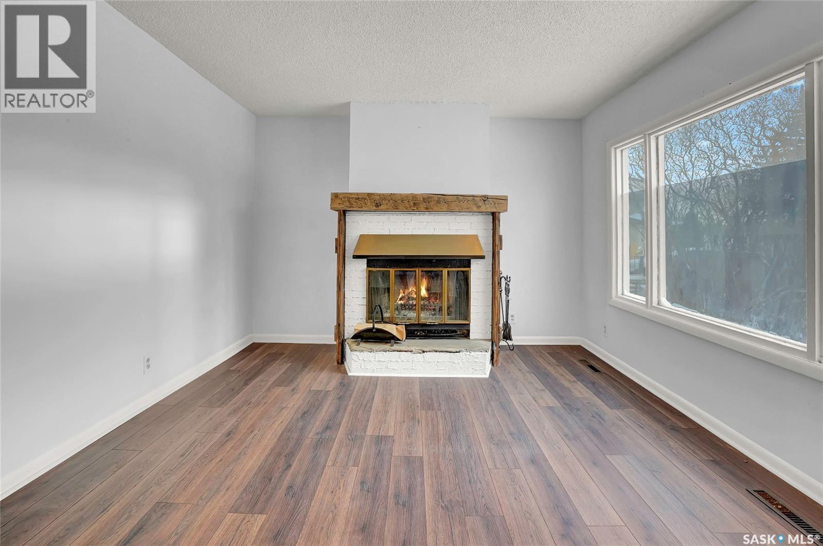5336 5Th Avenue, Regina, SK - Indoor Photo Showing Living Room With Fireplace