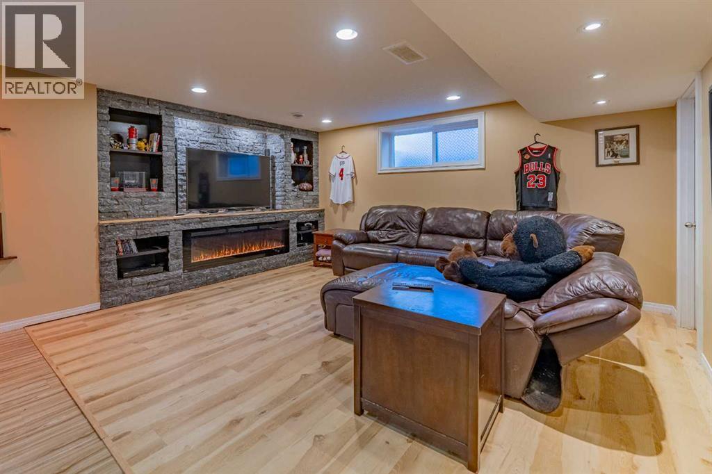142 West Pointe Circle, Cochrane, AB - Indoor With Fireplace