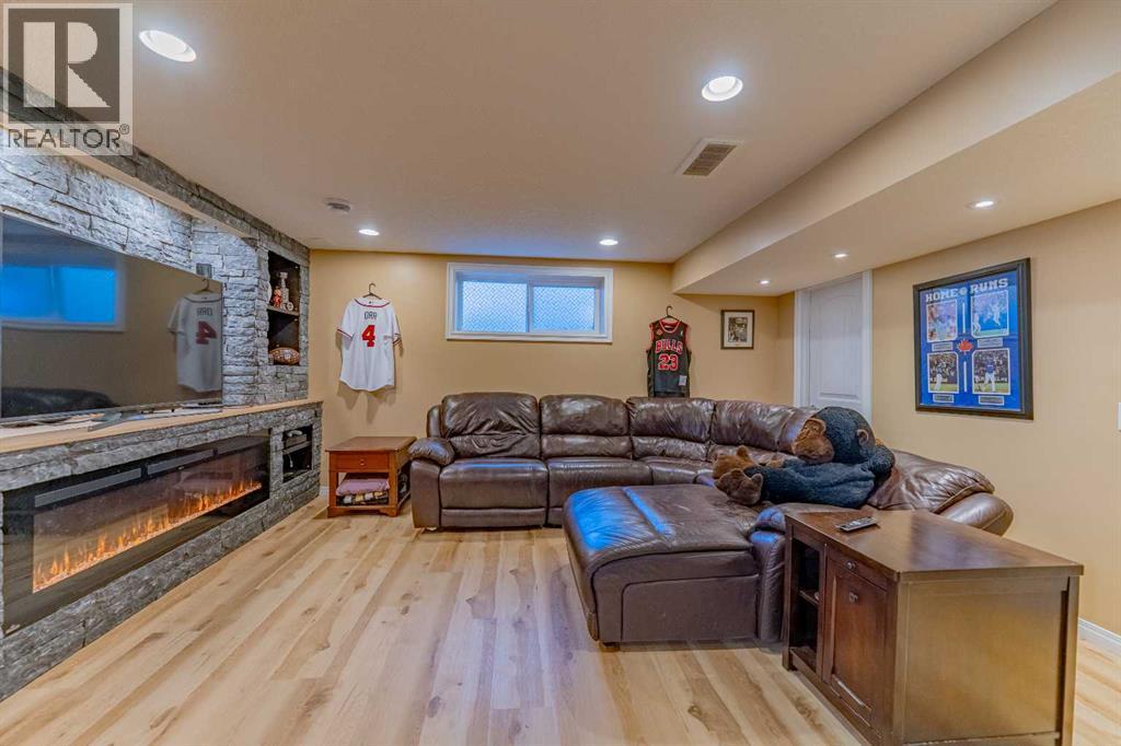 142 West Pointe Circle, Cochrane, AB - Indoor With Fireplace