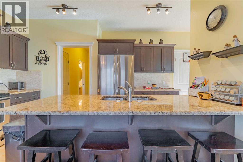 142 West Pointe Circle, Cochrane, AB - Indoor Photo Showing Kitchen With Double Sink With Upgraded Kitchen