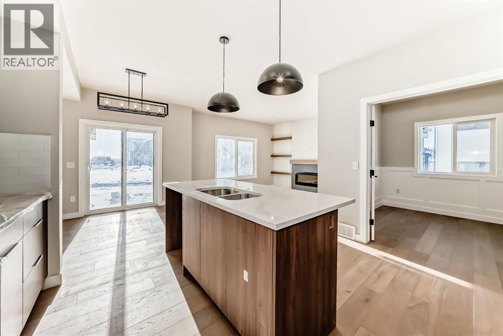 504 Heritage Boulevard, Cochrane, AB - Indoor Photo Showing Kitchen With Double Sink