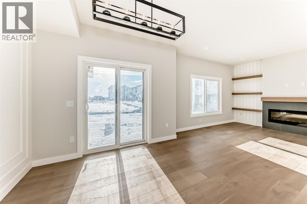504 Heritage Boulevard, Cochrane, AB - Indoor With Fireplace