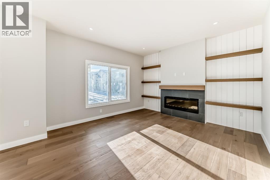 504 Heritage Boulevard, Cochrane, AB - Indoor Photo Showing Living Room With Fireplace
