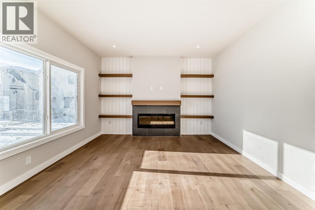 504 Heritage Boulevard, Cochrane, AB - Indoor Photo Showing Living Room With Fireplace