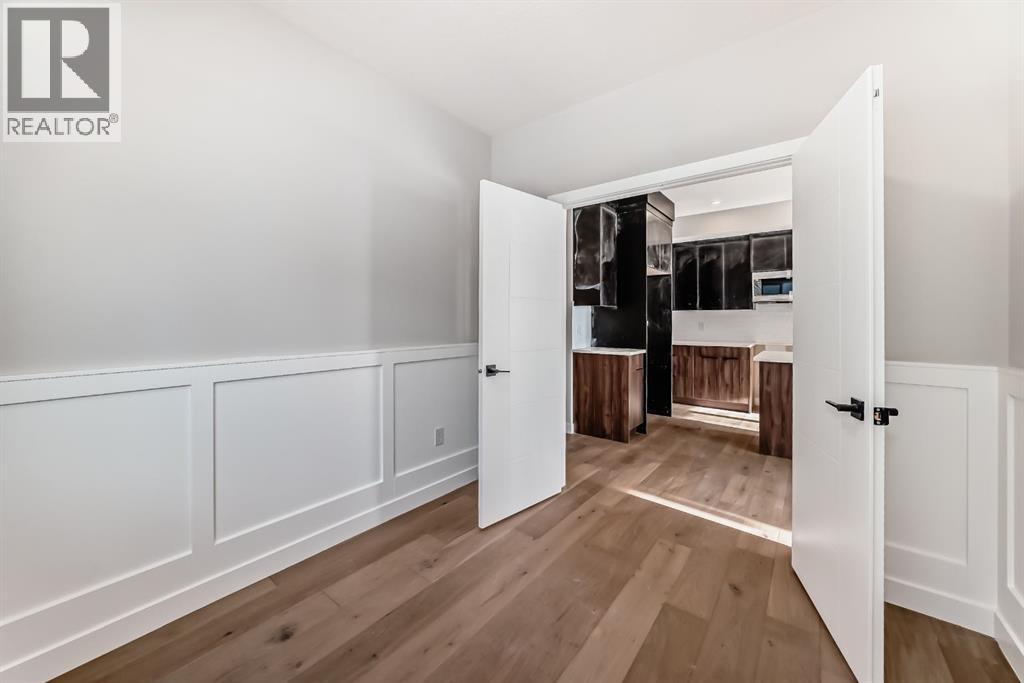 504 Heritage Boulevard, Cochrane, AB - Indoor Photo Showing Other Room