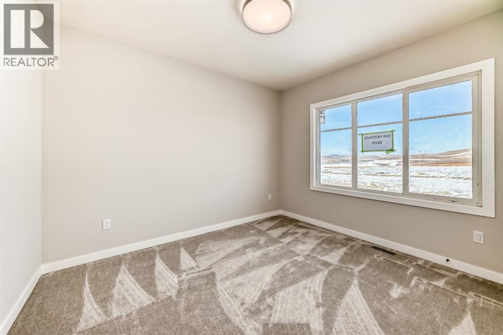 504 Heritage Boulevard, Cochrane, AB - Indoor Photo Showing Other Room