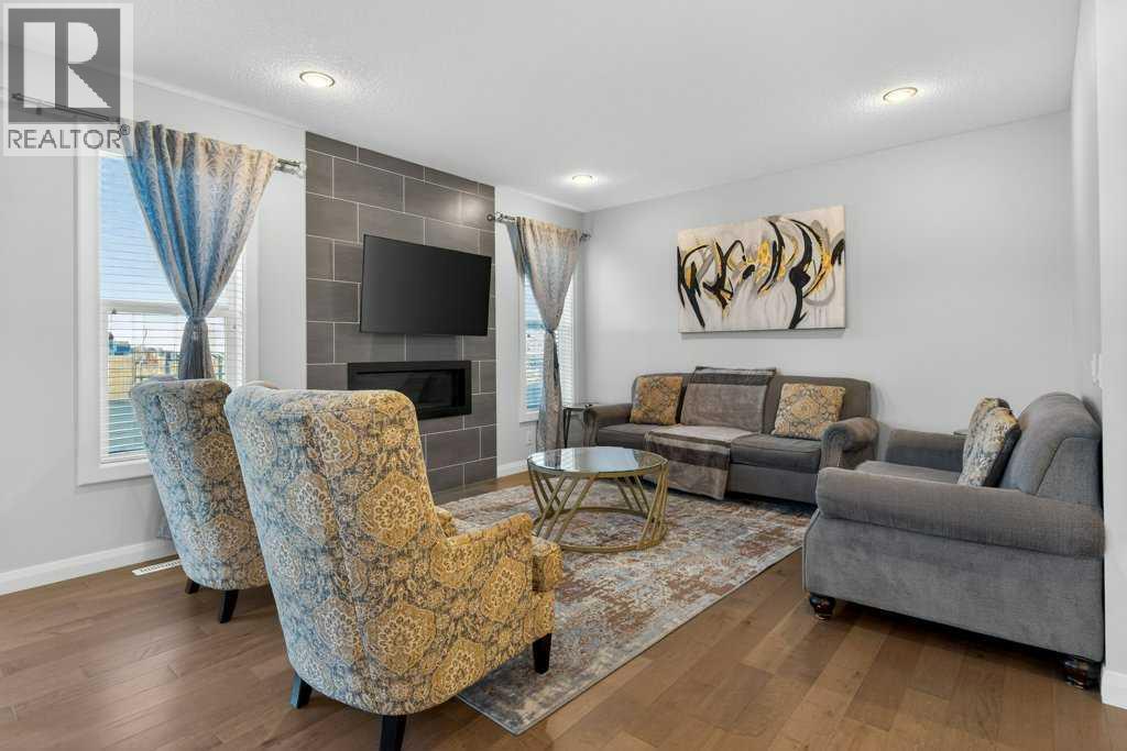 Living Room - 139 Evansglen Circle Nw, Calgary, AB - Indoor Photo Showing Living Room With Fireplace