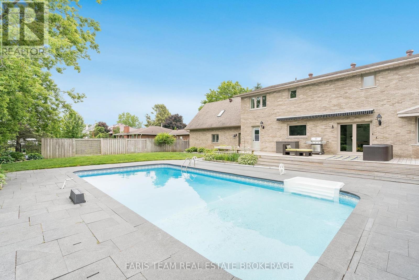 32 Cairns Boulevard, Springwater, ON - Outdoor With In Ground Pool With Backyard