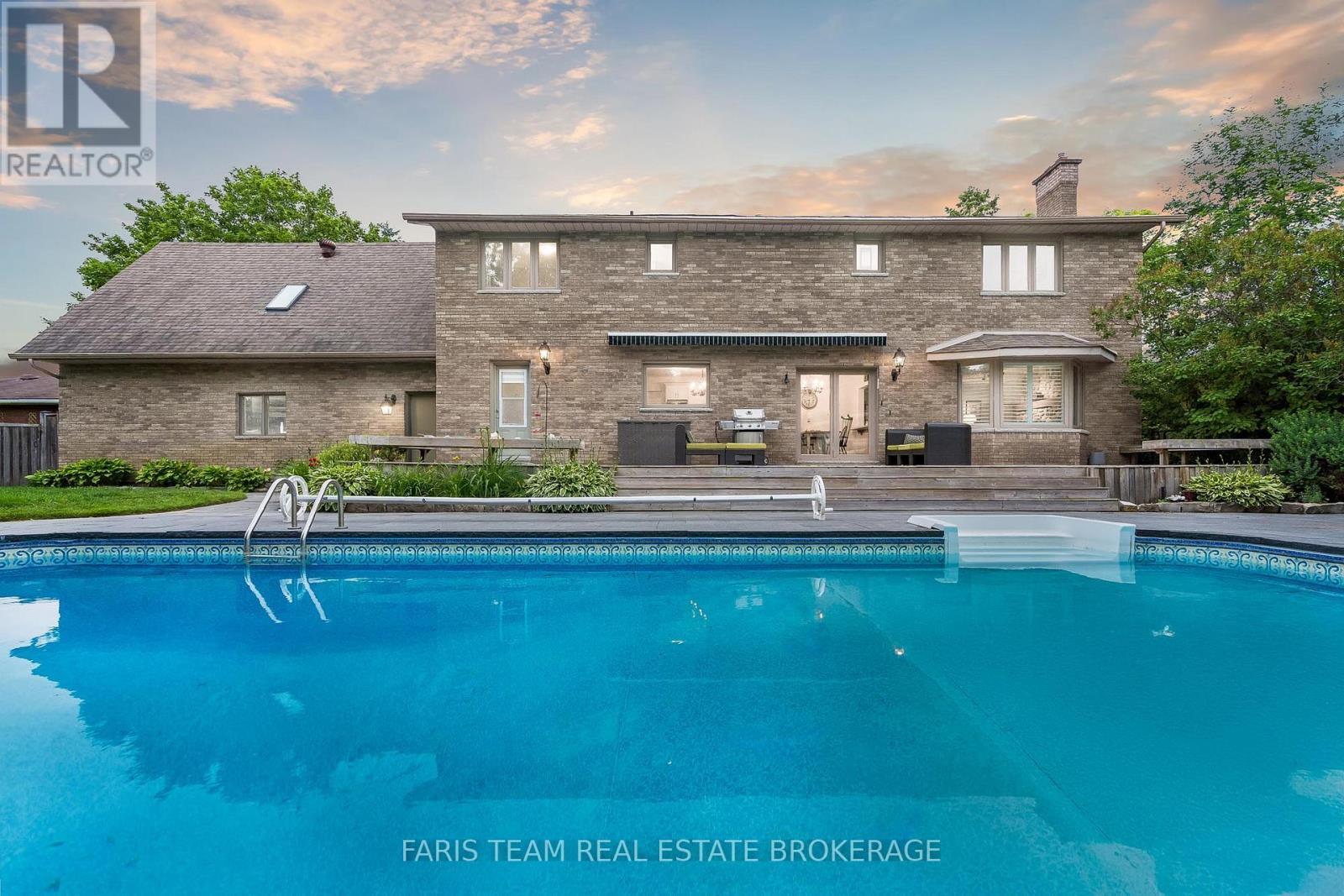 32 Cairns Boulevard, Springwater, ON - Outdoor With In Ground Pool