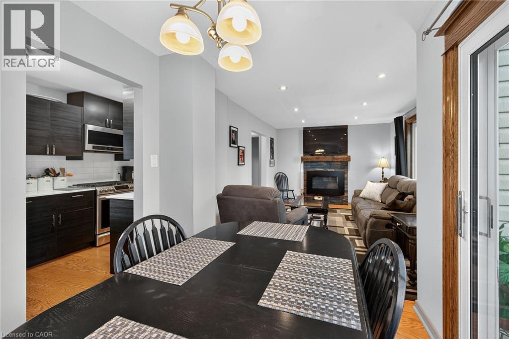 211 Birchcliffe Crescent, Hamilton, ON - Indoor Photo Showing Dining Room With Fireplace
