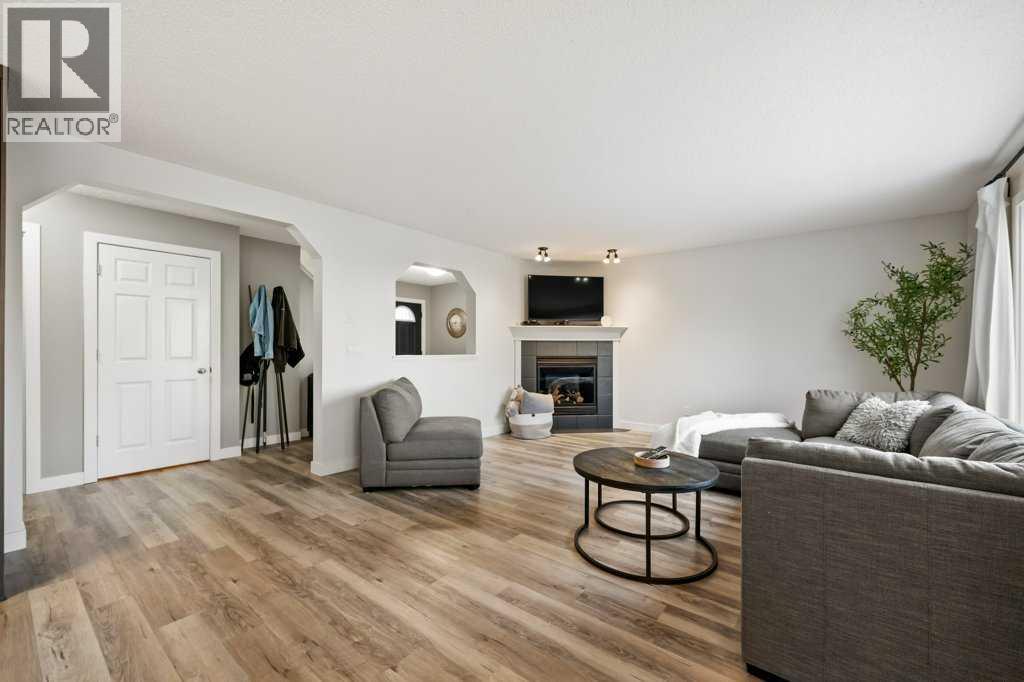 141 Lavender Link, Chestermere, AB - Indoor Photo Showing Living Room With Fireplace