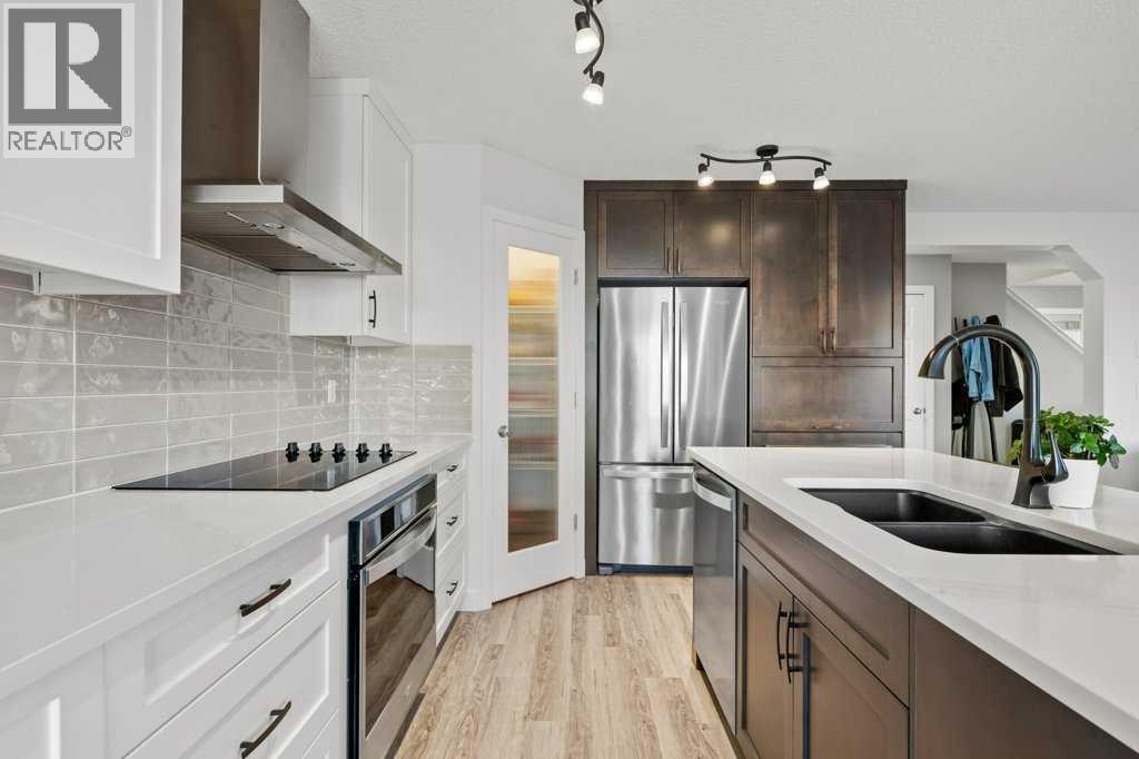 141 Lavender Link, Chestermere, AB - Indoor Photo Showing Kitchen With Double Sink With Upgraded Kitchen