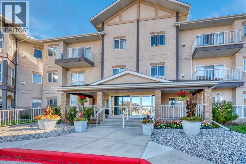 112, 43 Westlake Circle, Strathmore, AB - Outdoor With Balcony With Facade