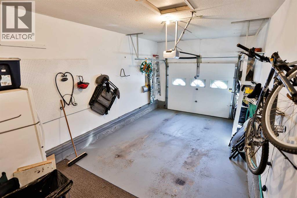 2, 135 Jerry Potts Boulevard W, Lethbridge, AB - Indoor Photo Showing Garage