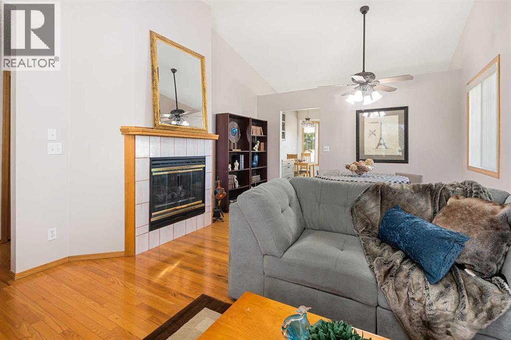 17, 1200 Milt Ford Lane, Carstairs, AB - Indoor Photo Showing Living Room With Fireplace