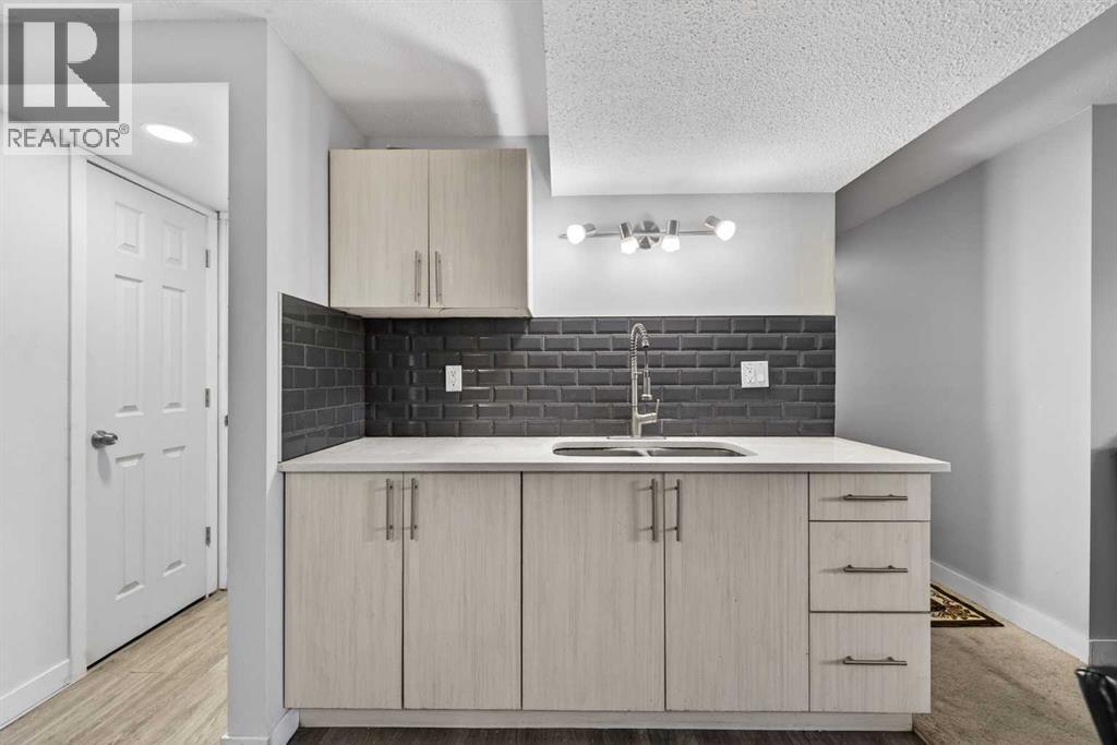 8 Malvern Crescent Ne, Calgary, AB - Indoor Photo Showing Kitchen With Double Sink