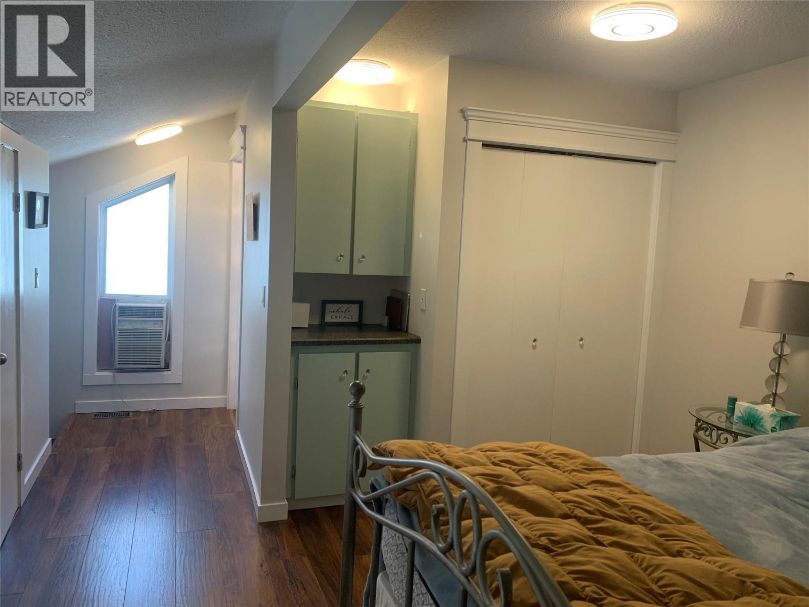 Air conditioner in loft when owner was living there - 3155 Gordon Drive Unit# 407, Kelowna, BC - Indoor Photo Showing Bedroom