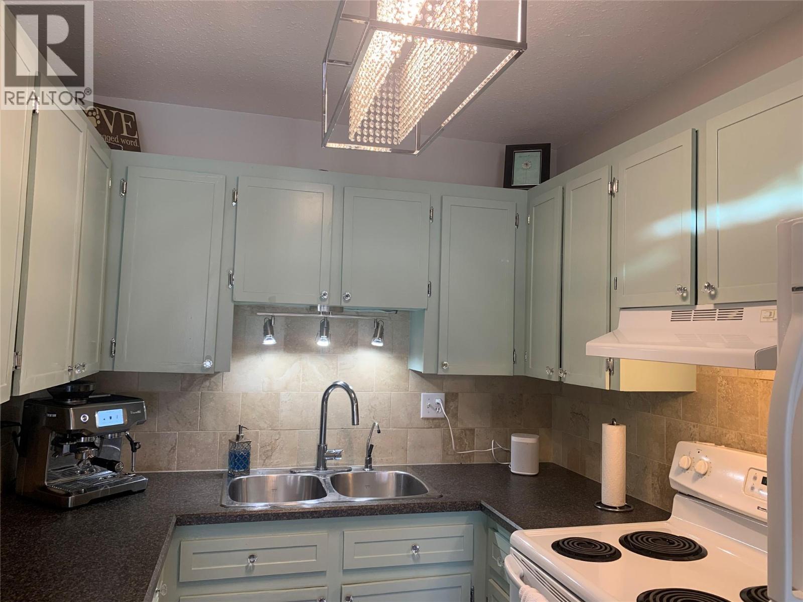 Close up of kitchen - 3155 Gordon Drive Unit# 407, Kelowna, BC - Indoor Photo Showing Kitchen With Double Sink