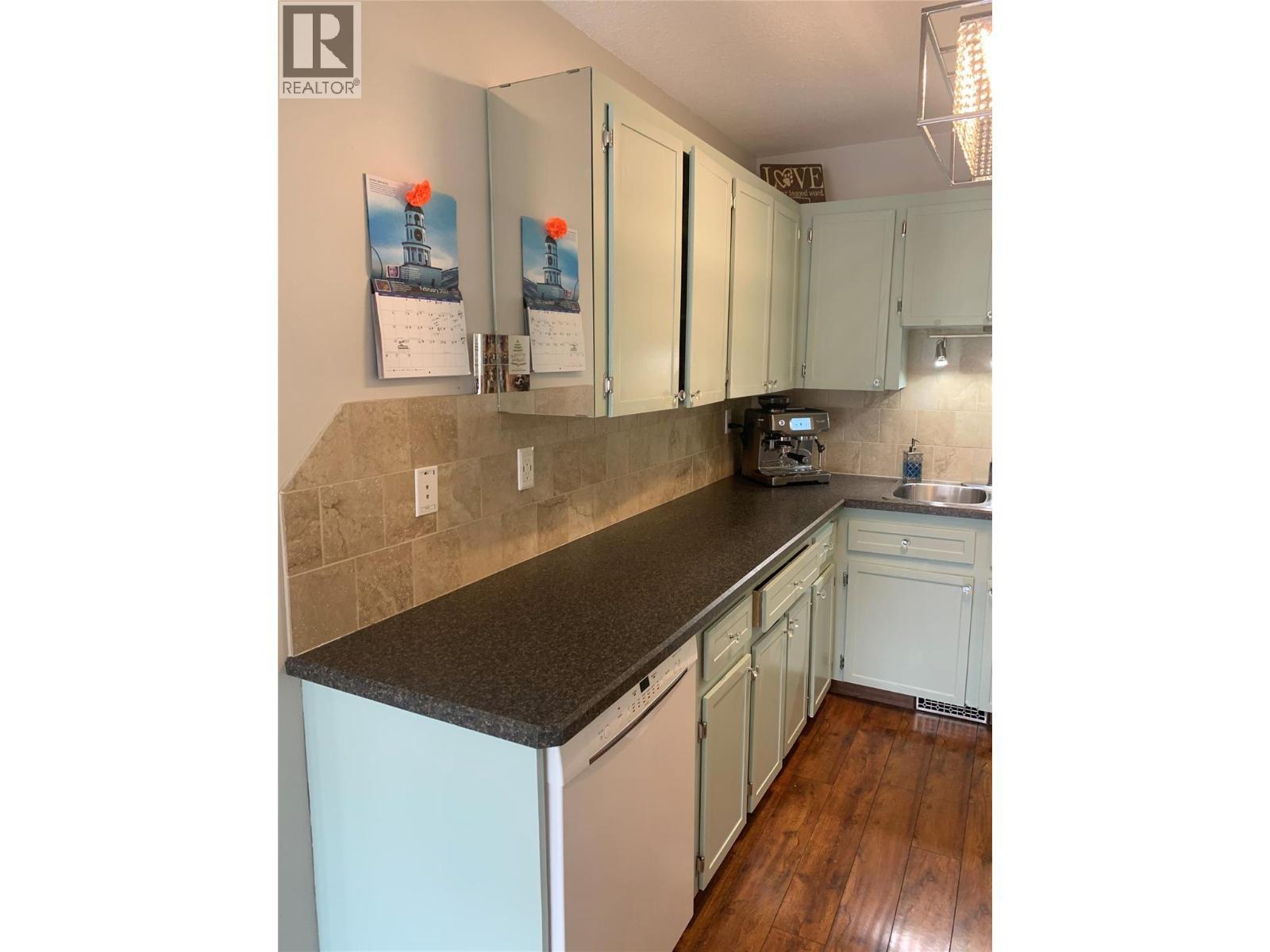 Dishwasher & great counter space! - 3155 Gordon Drive Unit# 407, Kelowna, BC - Indoor Photo Showing Kitchen