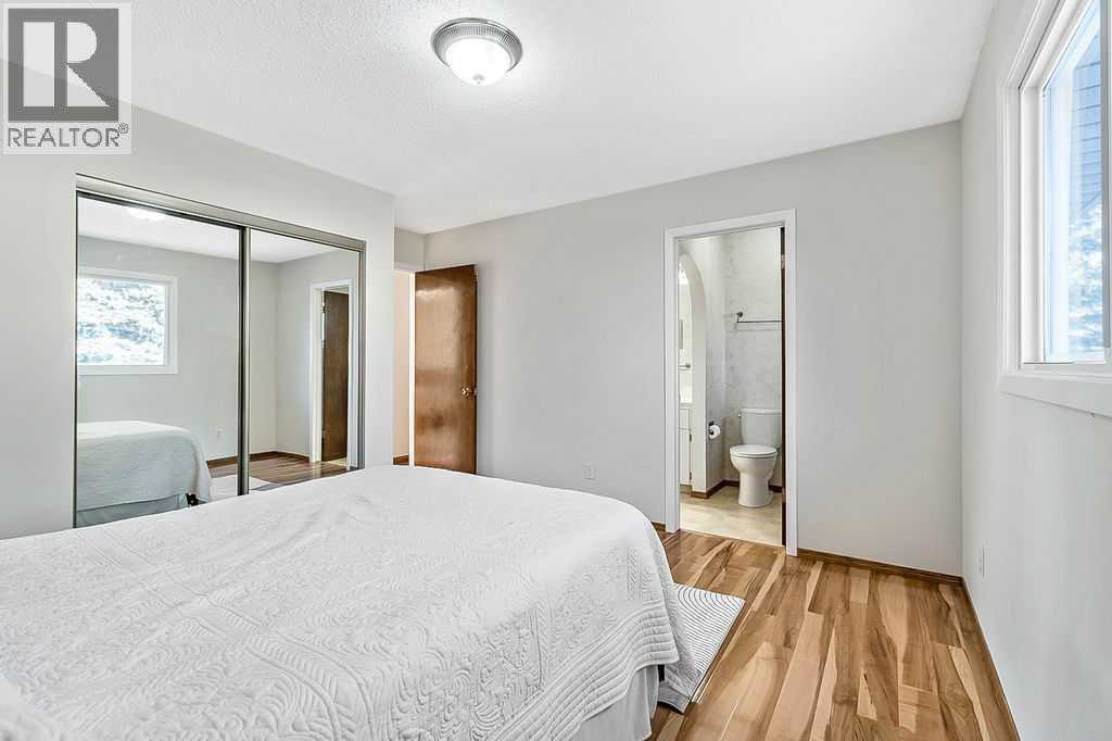 107 Lock Crescent, Okotoks, AB - Indoor Photo Showing Bedroom