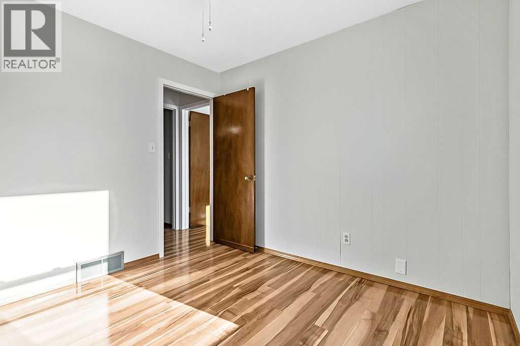 107 Lock Crescent, Okotoks, AB - Indoor Photo Showing Other Room