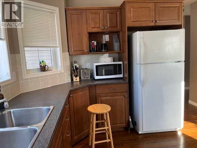 901 Nativity Bay, Rural Rocky View County, AB - Indoor Photo Showing Kitchen With Double Sink