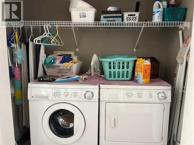 901 Nativity Bay, Rural Rocky View County, AB - Indoor Photo Showing Laundry Room