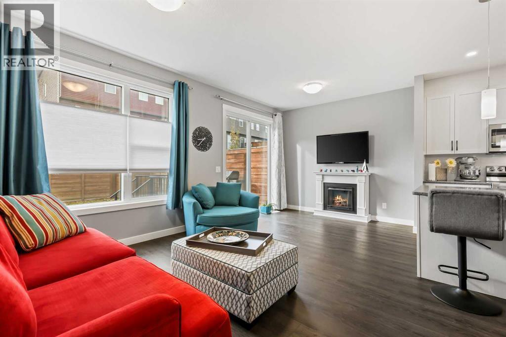 3 Sage Bluff Heights Nw, Calgary, AB - Indoor Photo Showing Living Room With Fireplace