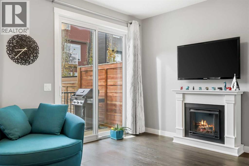 3 Sage Bluff Heights Nw, Calgary, AB - Indoor Photo Showing Living Room With Fireplace