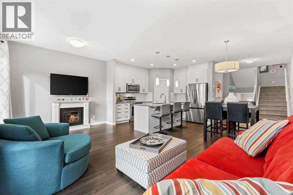 3 Sage Bluff Heights Nw, Calgary, AB - Indoor Photo Showing Living Room With Fireplace