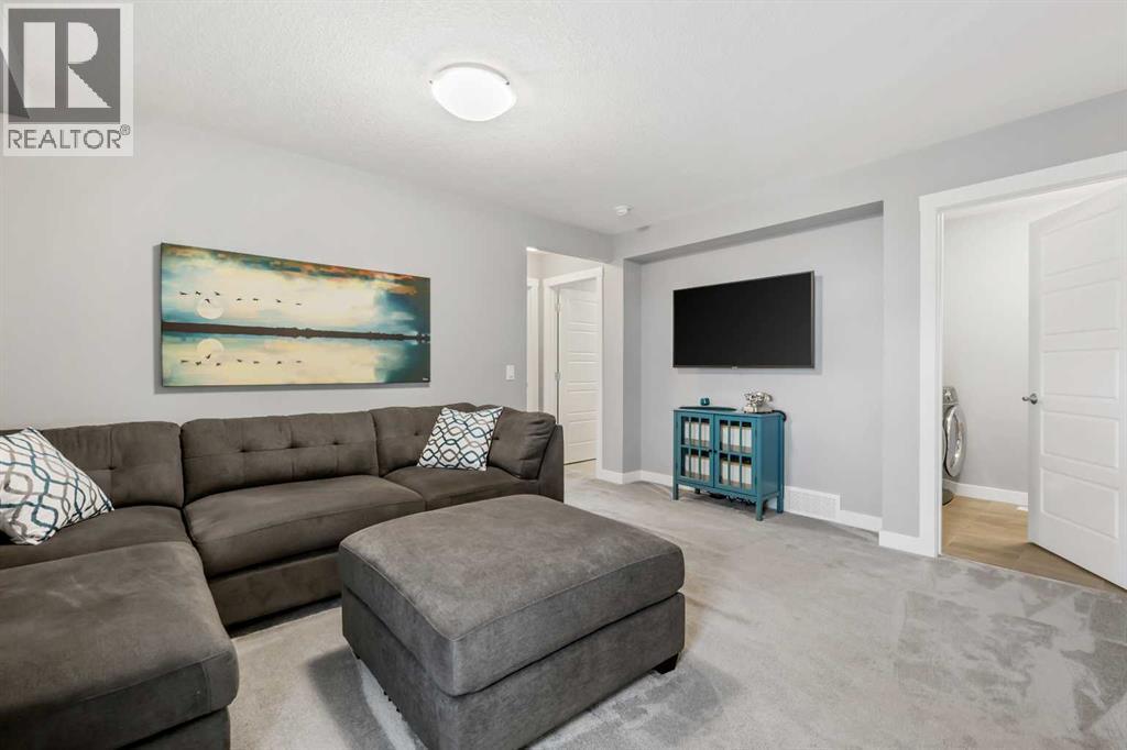 3 Sage Bluff Heights Nw, Calgary, AB - Indoor Photo Showing Living Room With Fireplace