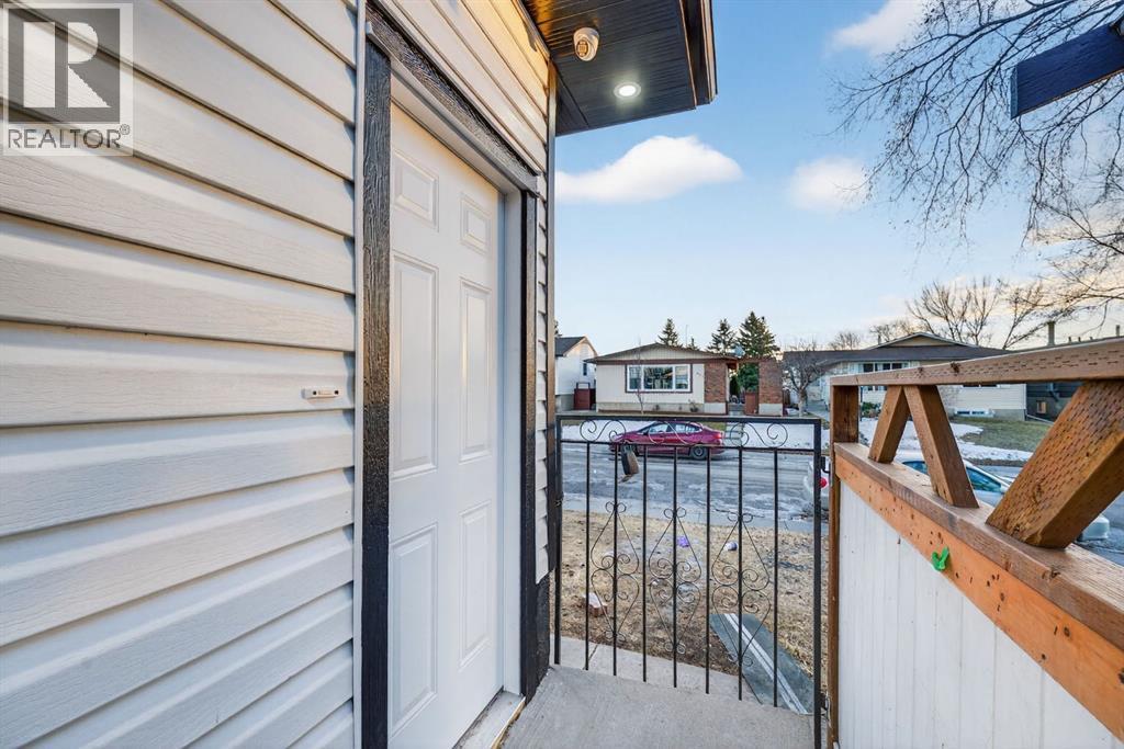 Separate side entrance to illegal suites - 420 Pinegreen Close Ne, Calgary, AB - Outdoor With Exterior