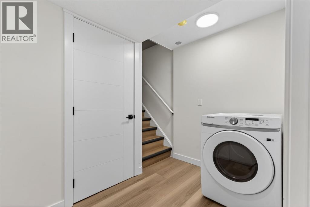 Dryer - 420 Pinegreen Close Ne, Calgary, AB - Indoor Photo Showing Laundry Room