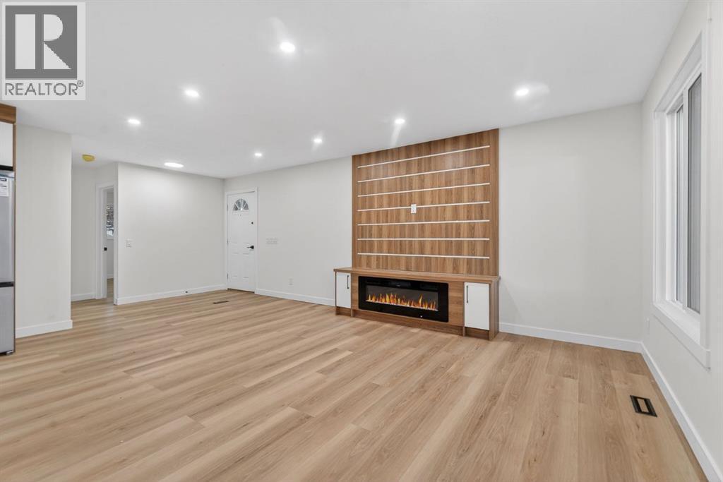 420 Pinegreen Close Ne, Calgary, AB - Indoor With Fireplace