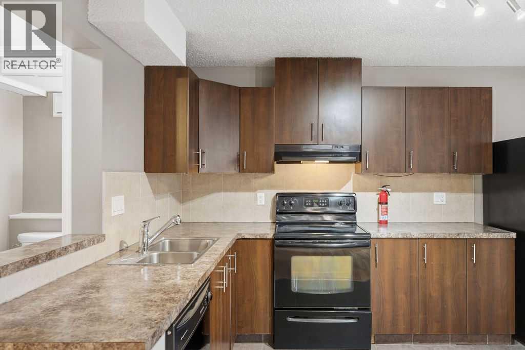 132 Riverglen Crescent Se, Calgary, AB - Indoor Photo Showing Kitchen With Double Sink