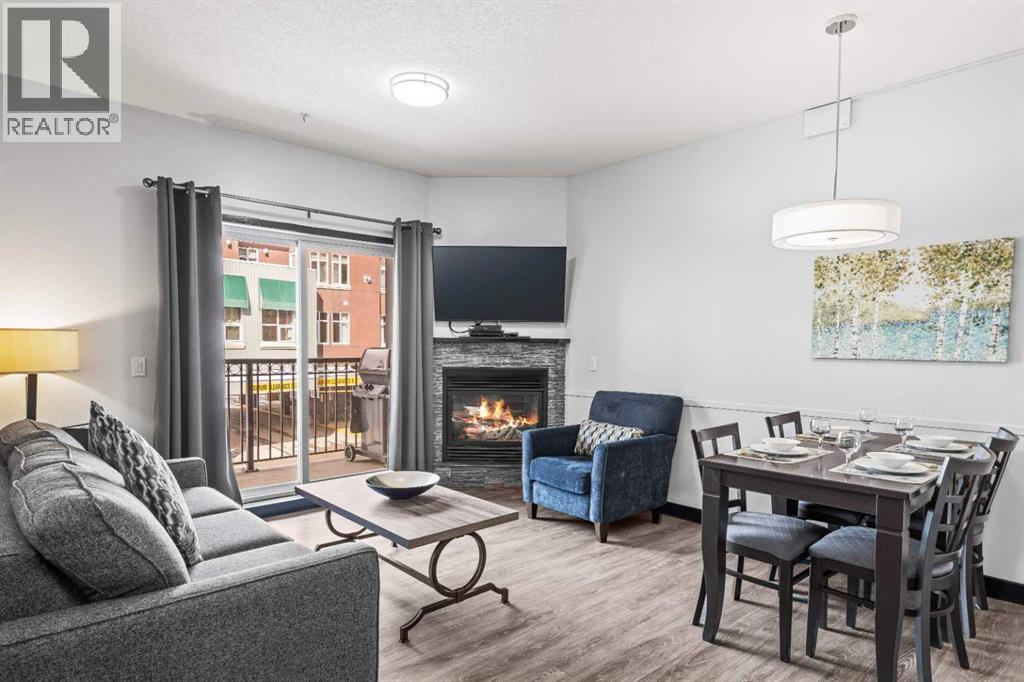 205 Rot. A, 901 Mountain Street, Canmore, AB - Indoor With Fireplace