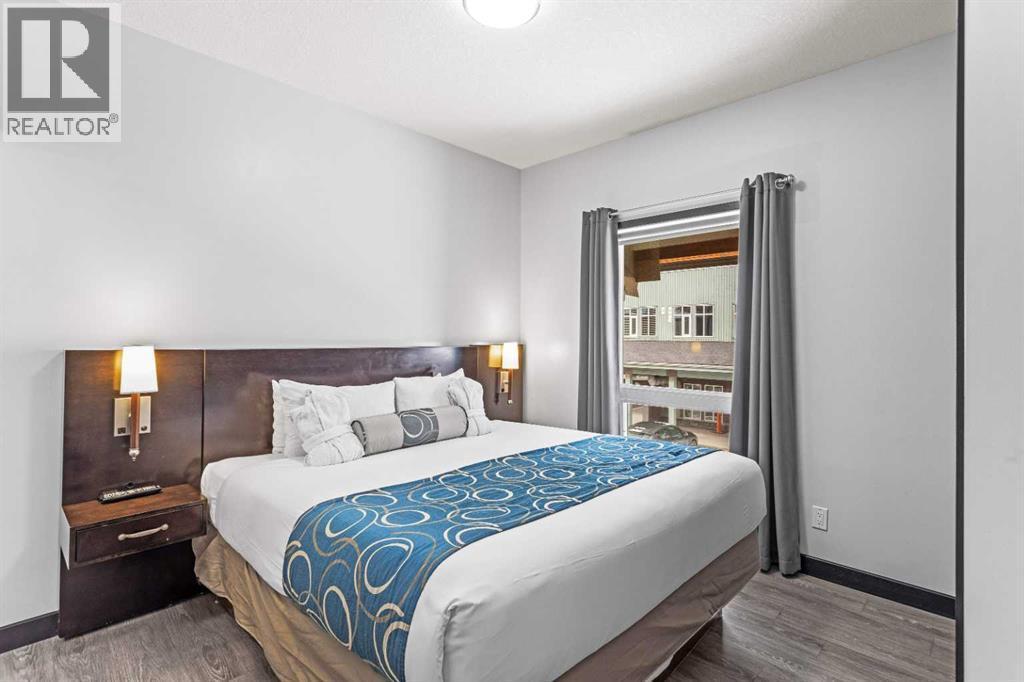 205 Rot. A, 901 Mountain Street, Canmore, AB - Indoor Photo Showing Bedroom