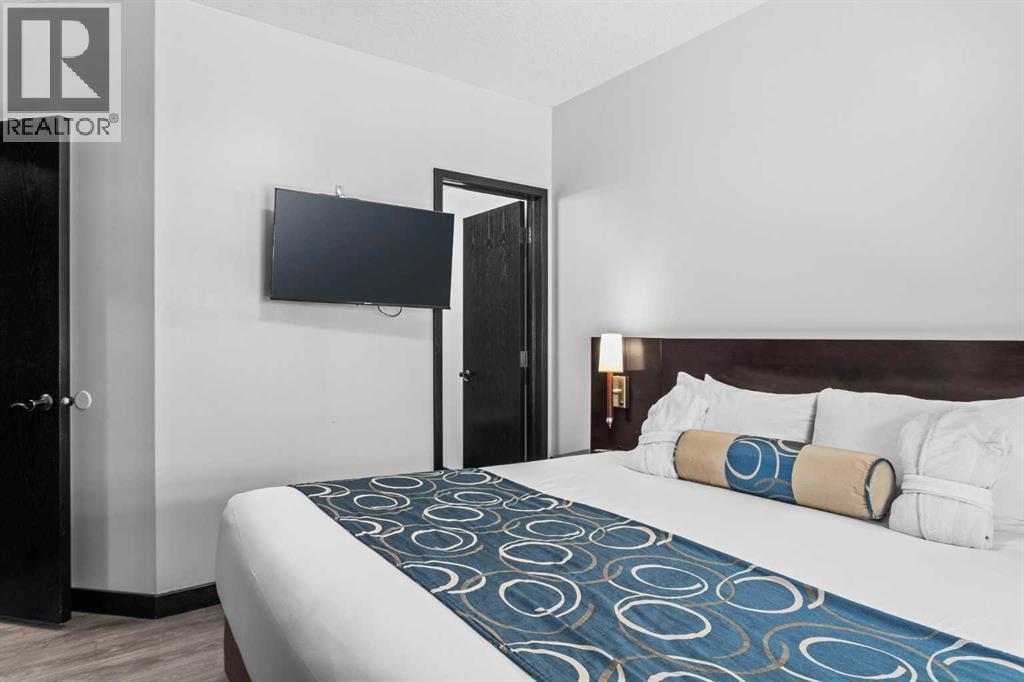 205 Rot. A, 901 Mountain Street, Canmore, AB - Indoor Photo Showing Bedroom