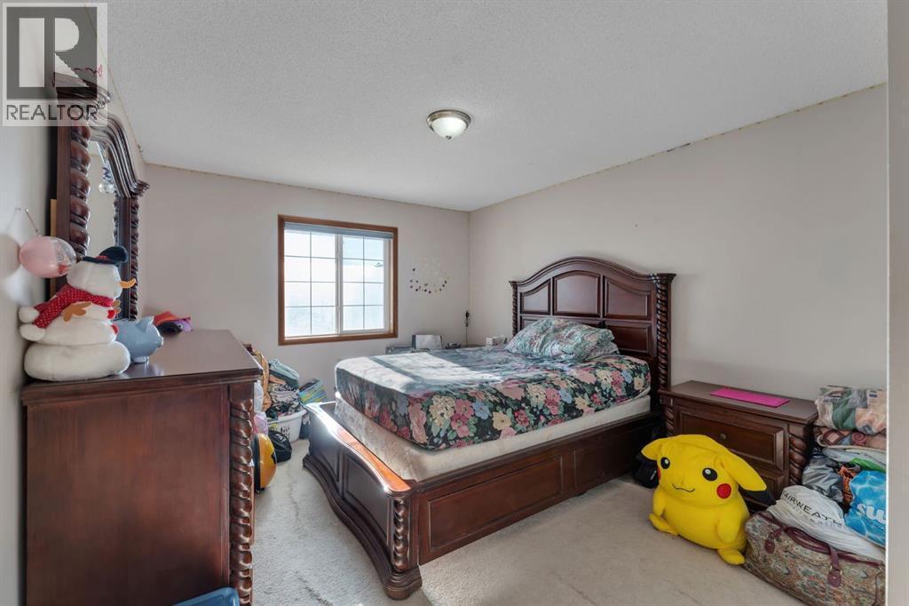 717 Coral Springs Boulevard Ne, Calgary, AB - Indoor Photo Showing Bedroom